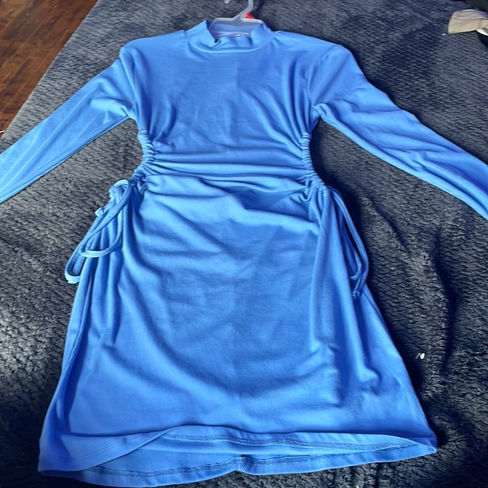medium sized periwinkle blue long sleeve dress adjustable side cut out